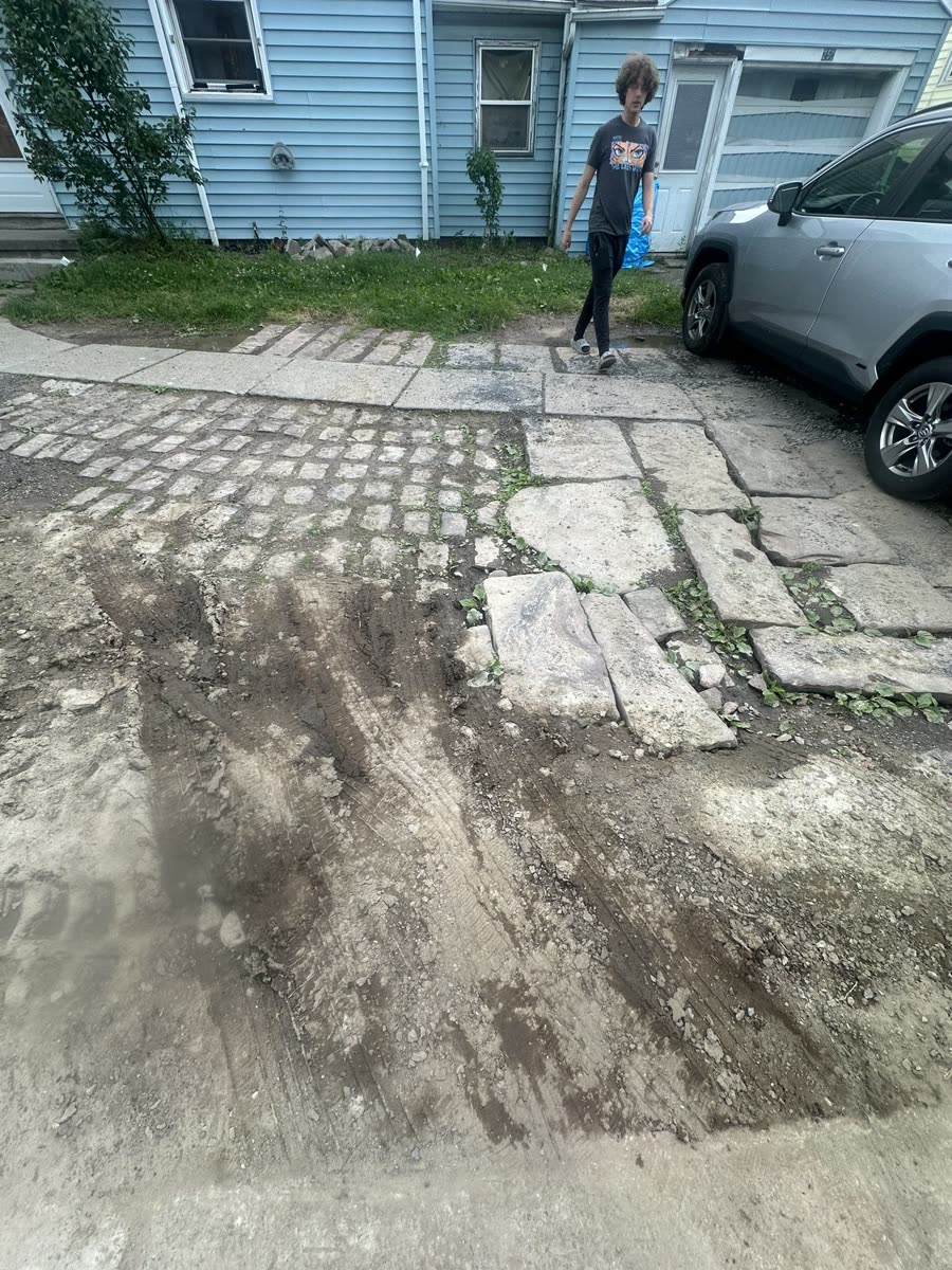 Failed cobblestone and flagstone driveway before removal — Rochester NY
