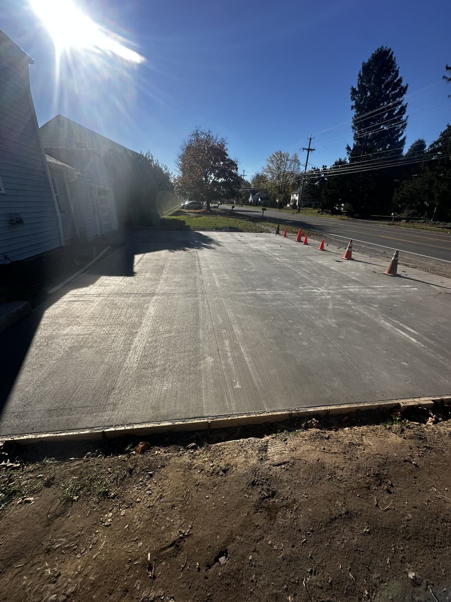 Completed broom-finish concrete driveway — Keystone Masonry Rochester NY