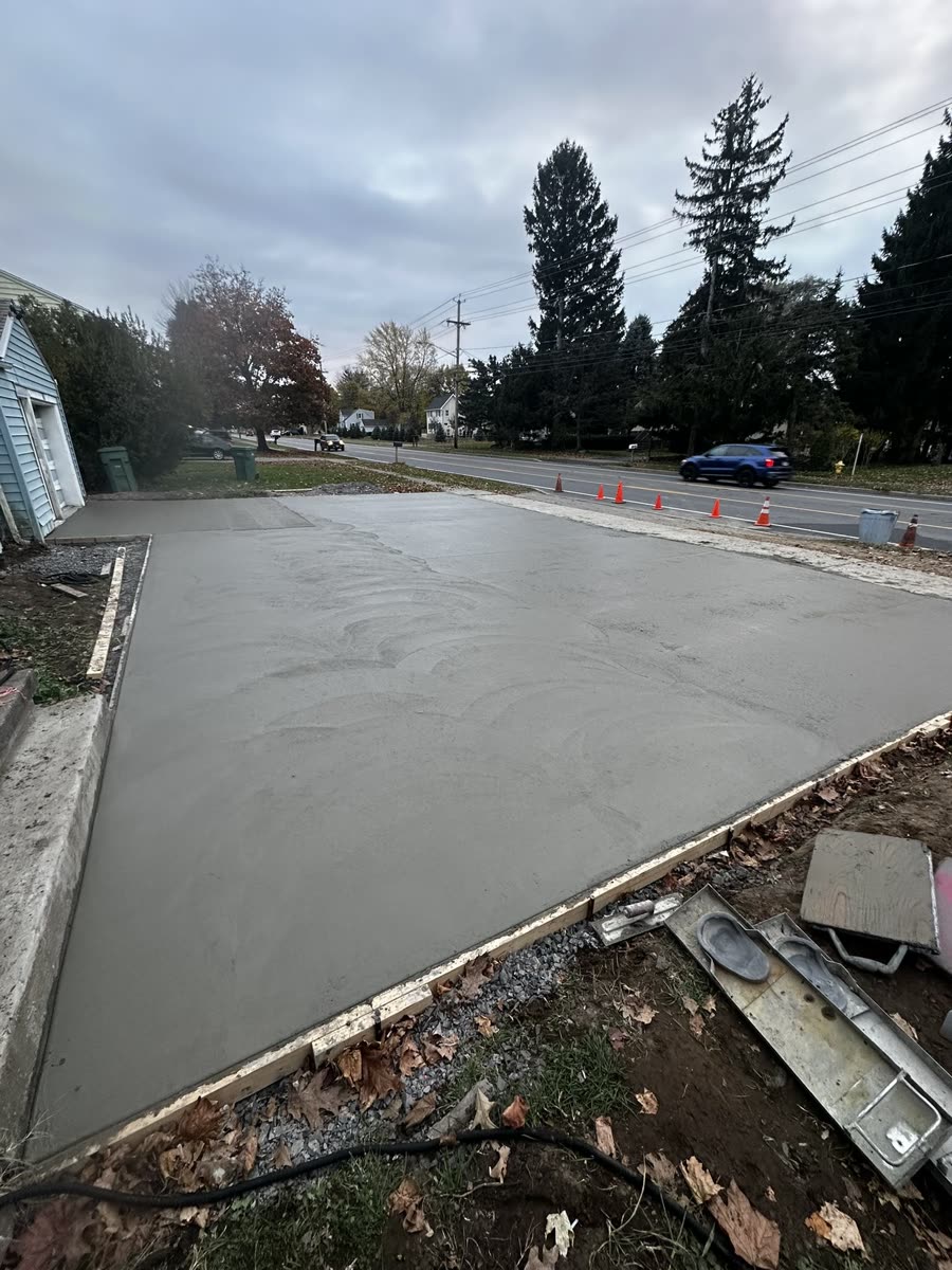 Concrete driveway finishing stage, expansion joints cut — Keystone Masonry Rochester NY
