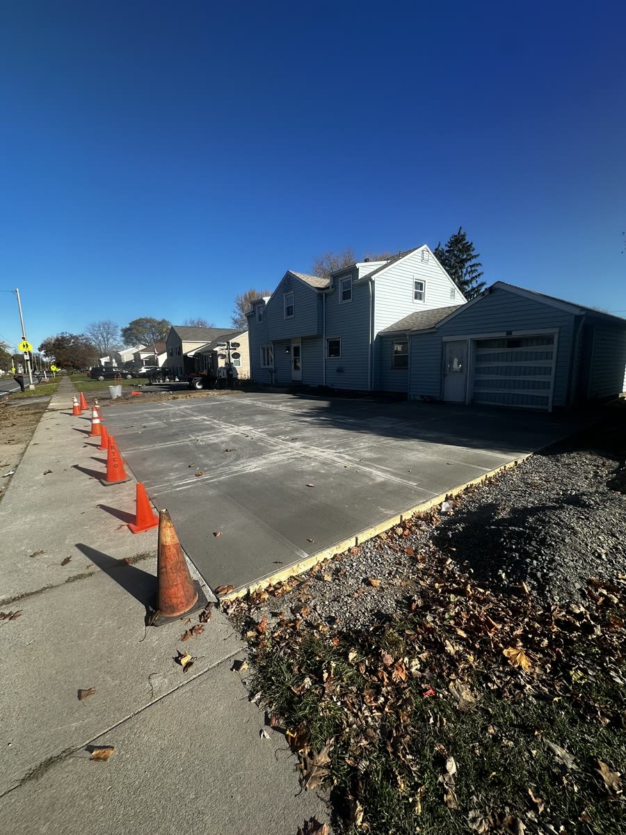 Finished concrete driveway from street view — Keystone Masonry Rochester NY